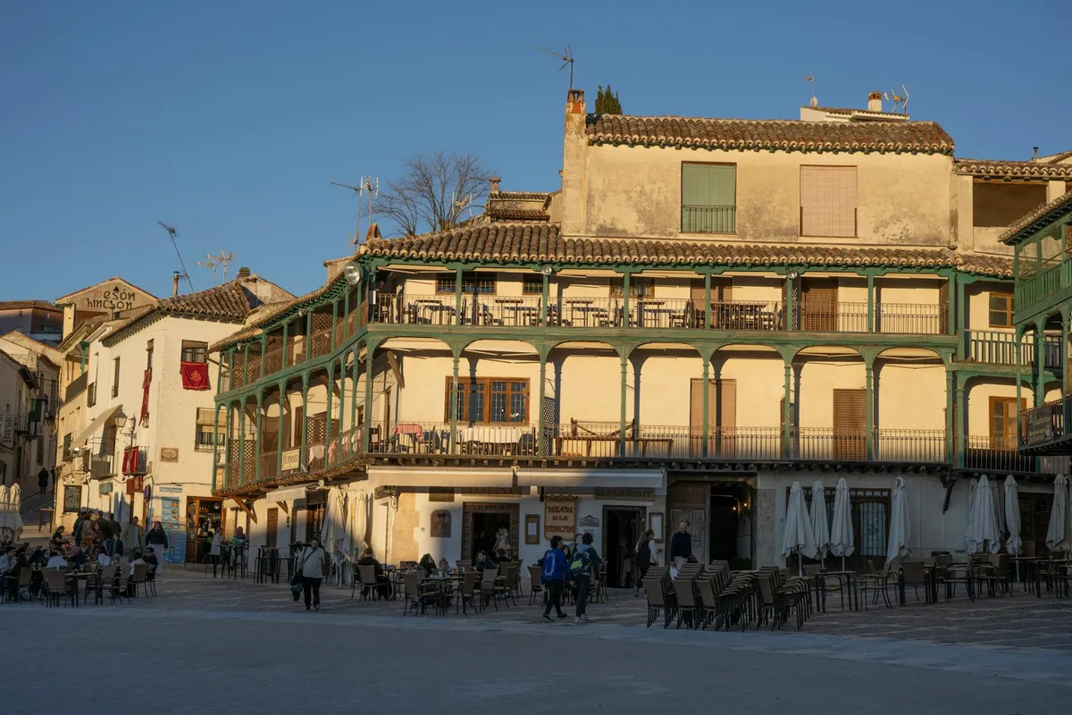 A Mediterranean plaza with cafés in afternoon light